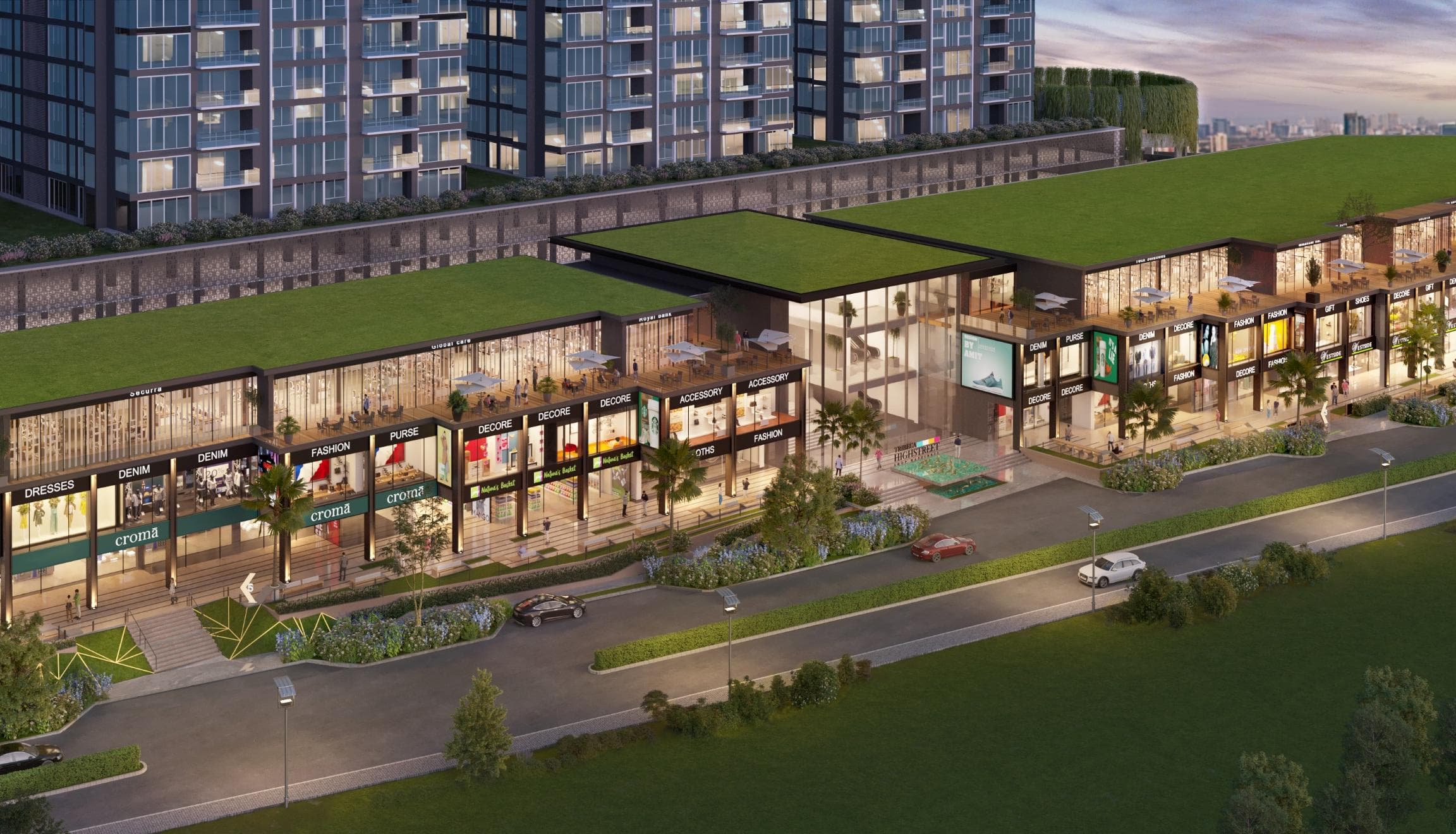 A vibrant, modern high-street shopping area with multiple storefronts.